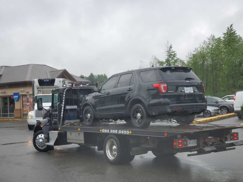 We Do Recover Towing & Scrap Car Removal towing truck is moving junk cash